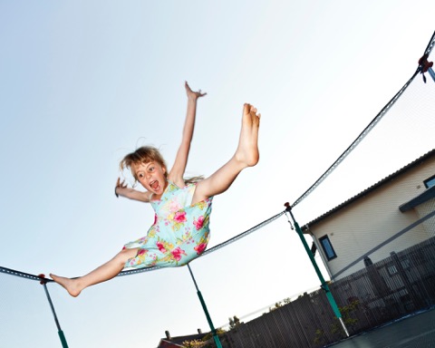 Girl Jumping On Trampoline