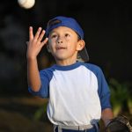 Little Boy Catching Baseball