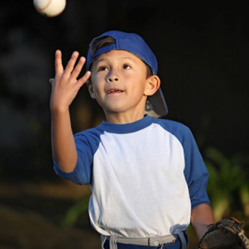 Little Boy Catching Baseball