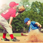 Baseball player sliding into second base