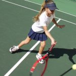 Young Girl Playing Tennis
