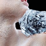 women icing shoulder