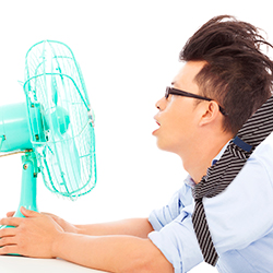 Man tries to cool off with high-speed fan